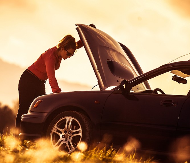 Woman-With-Disabled-Car